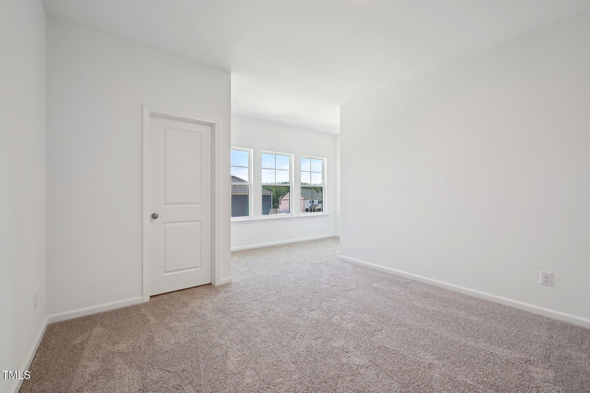 1609 Malcus Court, Unit 67 Fuquay-Varina, NC 27526 - Photo 33 of 40 a view of an empty room with a window