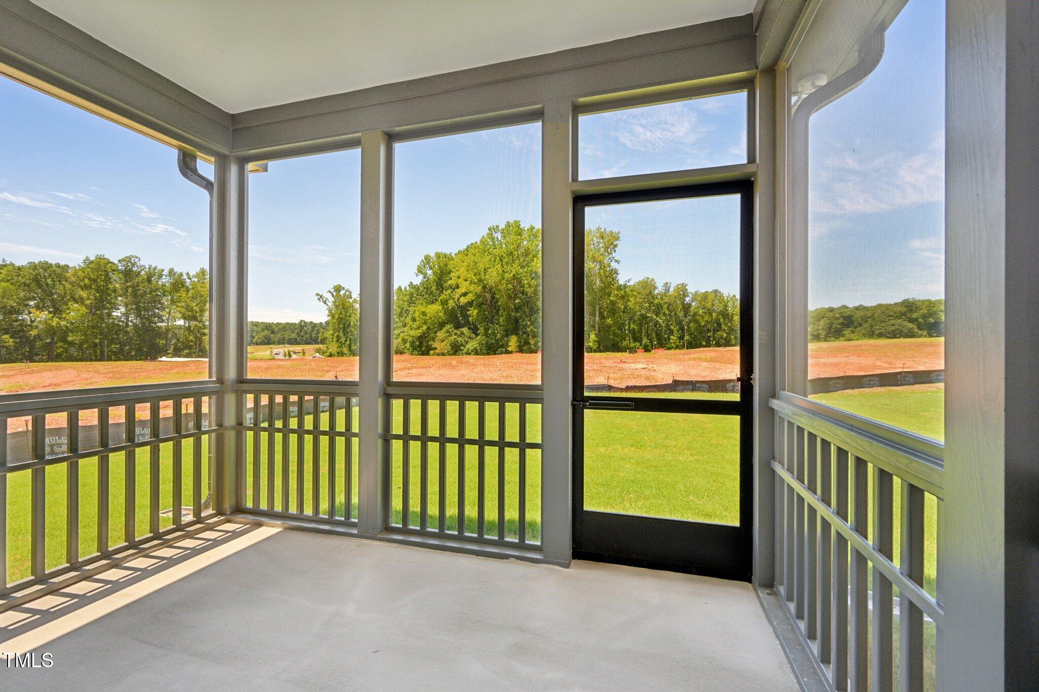 1609 Malcus Court, Unit 67 Fuquay-Varina, NC 27526 - Photo 35 of 40 a view of a glass door with a balcony