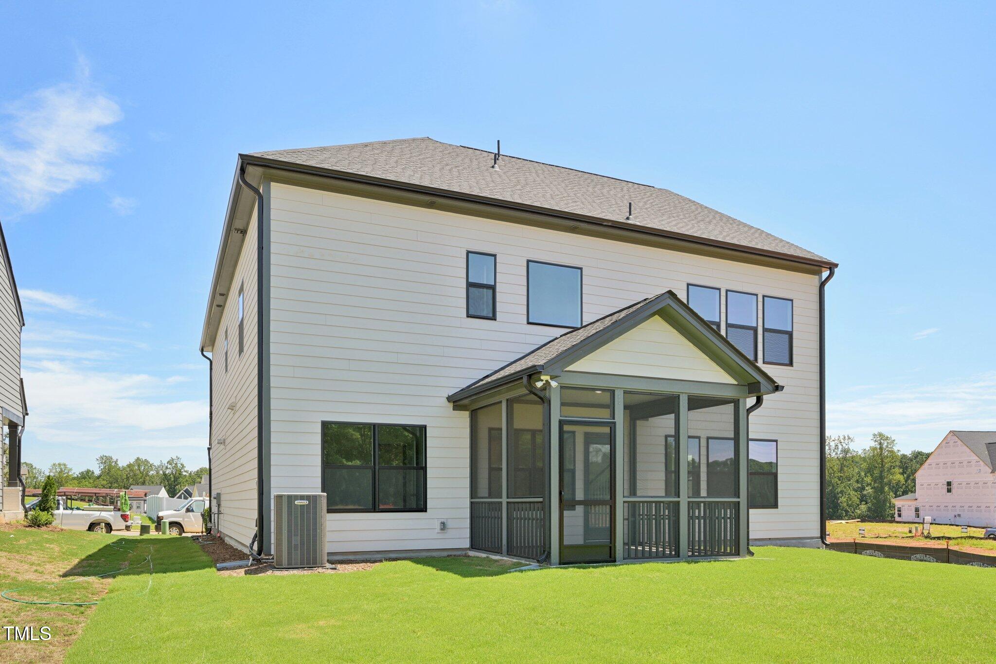 1609 Malcus Court, Unit 67 Fuquay-Varina, NC 27526 - Photo 36 of 40 a front view of a house with a yard