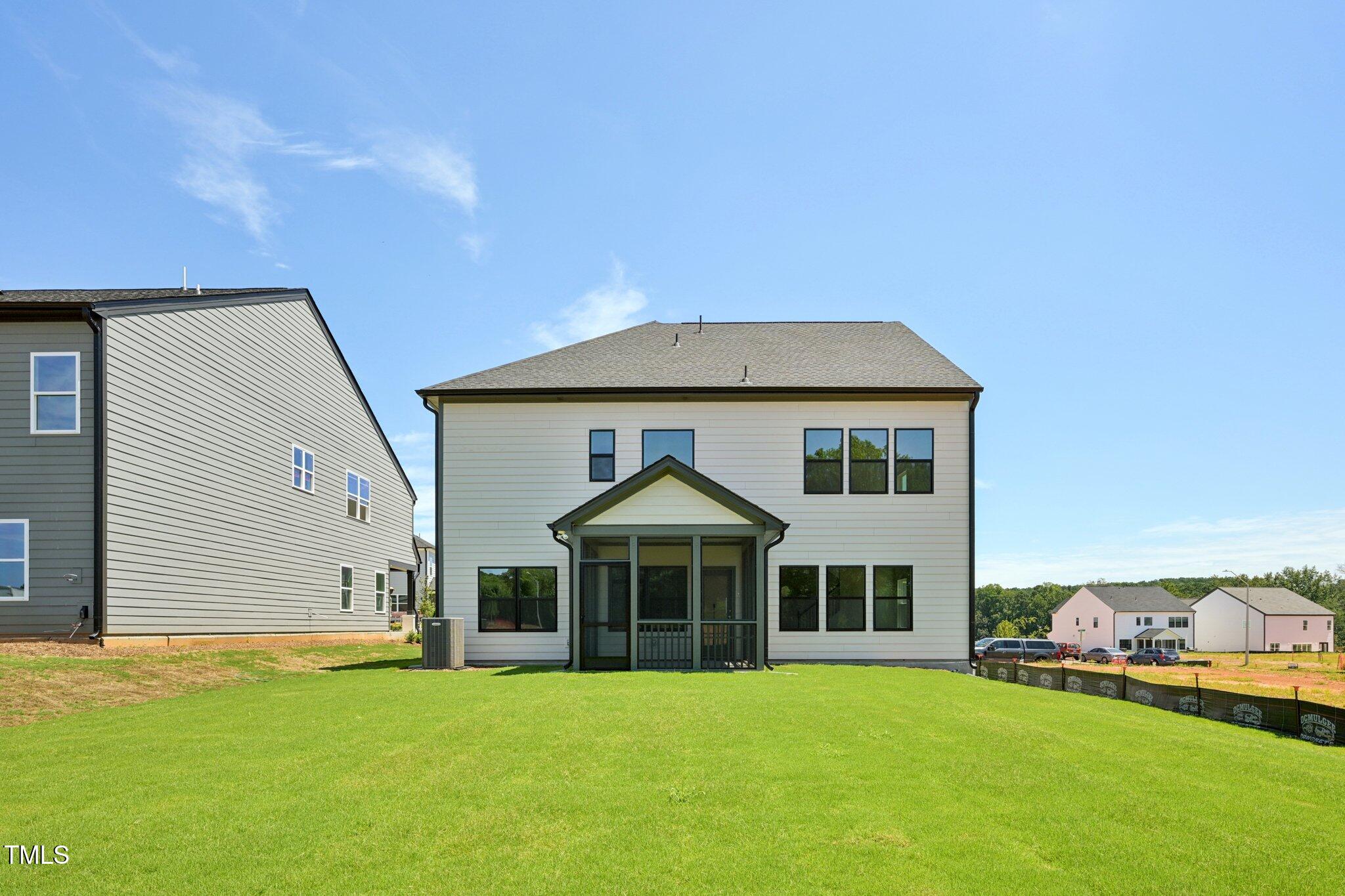 1609 Malcus Court, Unit 67 Fuquay-Varina, NC 27526 - Photo 37 of 40 a front view of a house with a yard