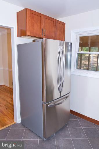 12407 Denley Road Silver Spring, MD 20906 - Photo 12 of 30 a refrigerator freezer sitting inside of a kitchen