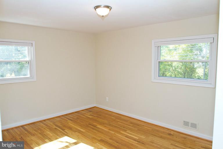 12407 Denley Road Silver Spring, MD 20906 - Photo 13 of 30 a view of a room with wooden floor and natural light