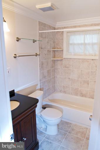 12407 Denley Road Silver Spring, MD 20906 - Photo 16 of 30 a bathroom with a sink a toilet and shower
