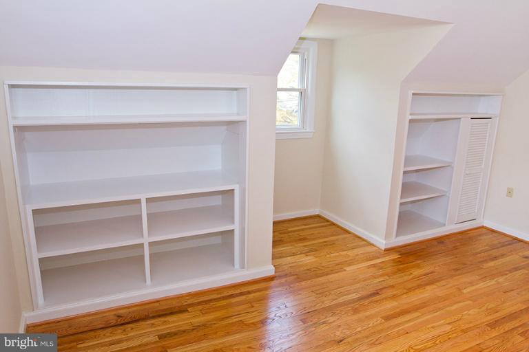 12407 Denley Road Silver Spring, MD 20906 - Photo 19 of 30 a view of an empty room with wooden floor and closet