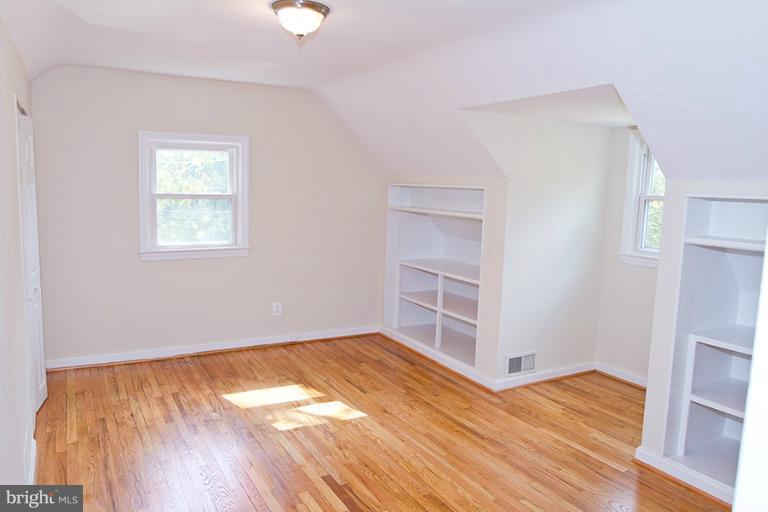 12407 Denley Road Silver Spring, MD 20906 - Photo 20 of 30 a view of empty room with wooden floor and fan