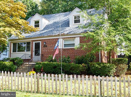 12407 Denley Road Silver Spring, MD 20906 - Photo 3 of 30 a front view of a house with a yard