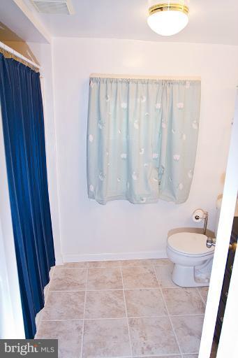 12407 Denley Road Silver Spring, MD 20906 - Photo 22 of 30 a bathroom with a toilet and a shower