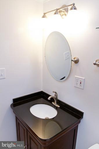 12407 Denley Road Silver Spring, MD 20906 - Photo 23 of 30 a bathroom with a sink and a mirror