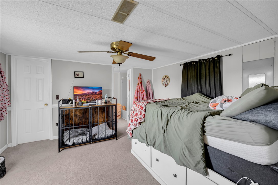 150 Newberry Road Walhalla, SC 29691 - Photo 15 of 47 Relax in this well-lit bedroom featuring a convenient ceiling fan for ultimate comfort.