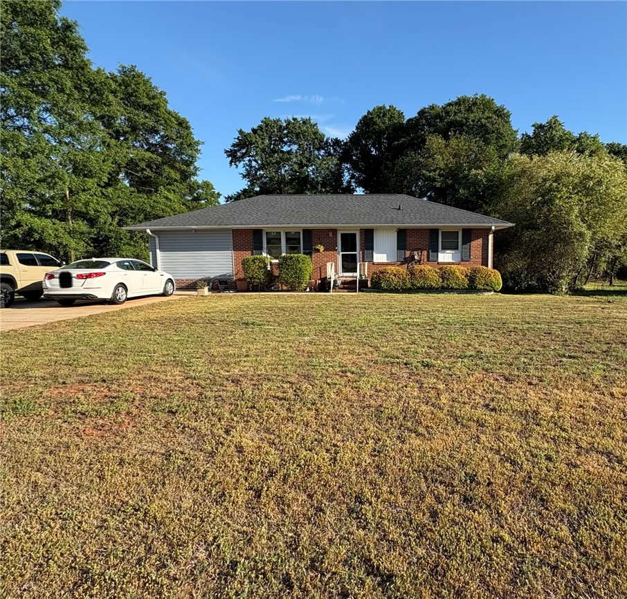 This charming home offers a spacious yard and classic curb appeal.