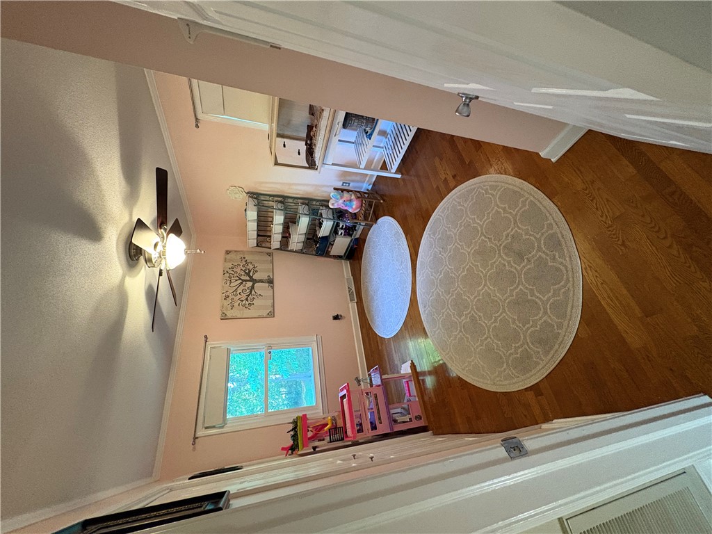 103 Elm Avenue Anderson, SC 29625 - Photo 18 of 19 This spacious bedroom features hardwood flooring and a ceiling fan, perfect for comfortable living.