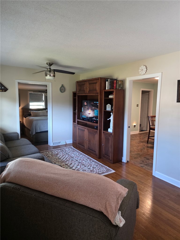 103 Elm Avenue Anderson, SC 29625 - Photo 19 of 19 This inviting space features classic hardwood flooring and a functional ceiling fan.