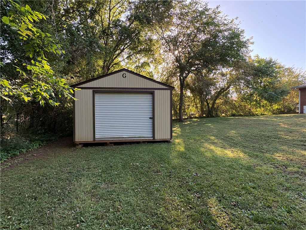 103 Elm Avenue Anderson, SC 29625 - Photo 6 of 19 This spacious yard offers ample green space and a convenient shed for all your outdoor needs.
