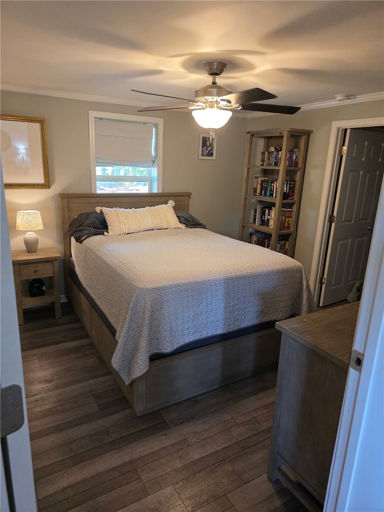 103 Elm Avenue Anderson, SC 29625 - Photo 7 of 19 This inviting bedroom features rich hardwood flooring and a stylish ceiling fan.