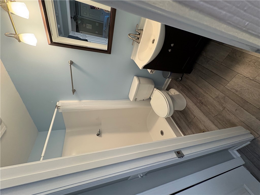 103 Elm Avenue Anderson, SC 29625 - Photo 9 of 19 This clean and bright bathroom offers essential amenities for daily routines.