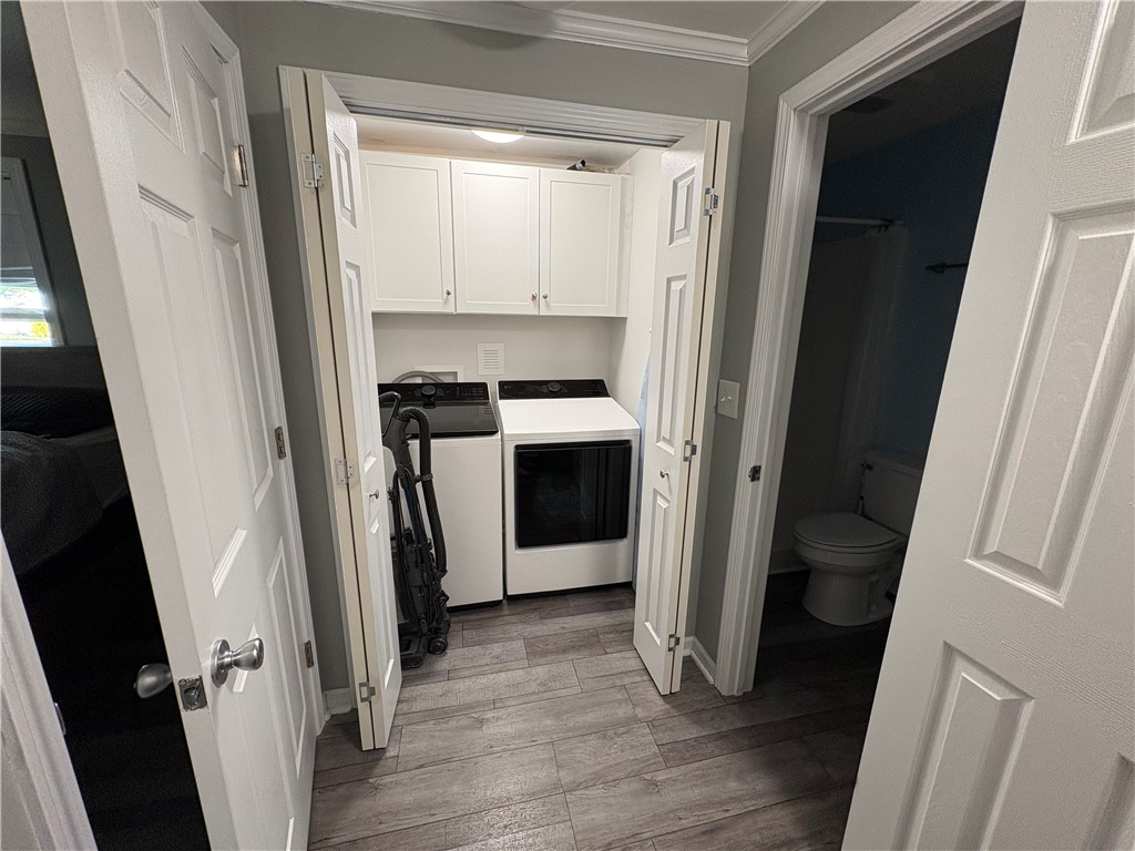 103 Elm Avenue Anderson, SC 29625 - Photo 10 of 19 This dedicated laundry space combines convenience with practical storage solutions.