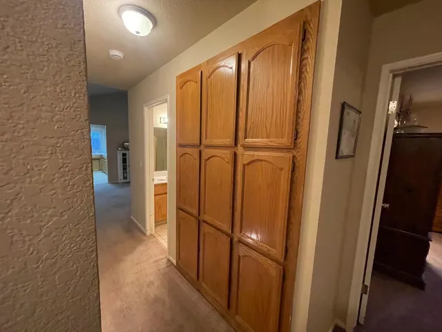 a bedroom with a bed and a cabinets