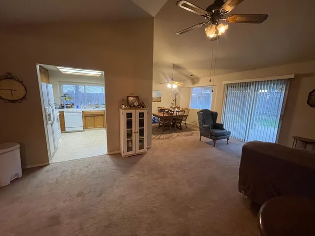 a view of a livingroom with furniture and a flat screen tv