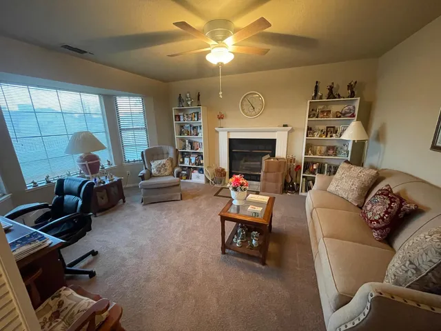 a bedroom with furniture and a chandelier