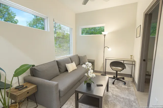 a living room with furniture and a window