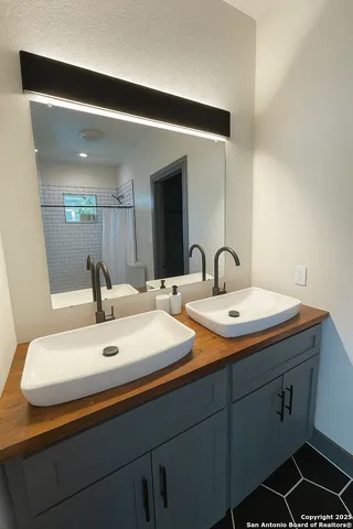 a bathroom with a sink and a mirror