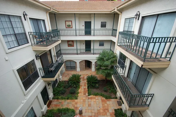 a view of an house with balcony and deck