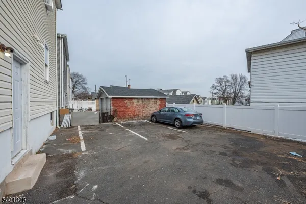 a view of a car in front of a house