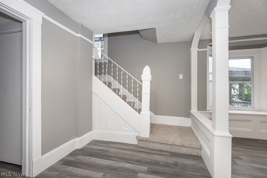 1892 Beersford Road Cleveland, OH 44112 - Photo 5 of 47 Stairway with dark hardwood / wood-style floors