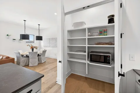 a view of a kitchen and workspace