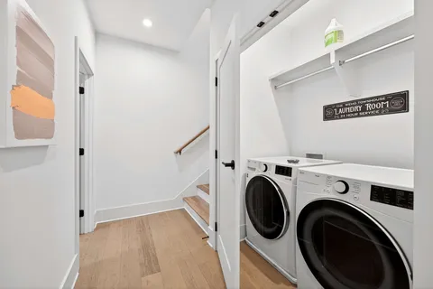 a view of storage and utility room with washer and dryer