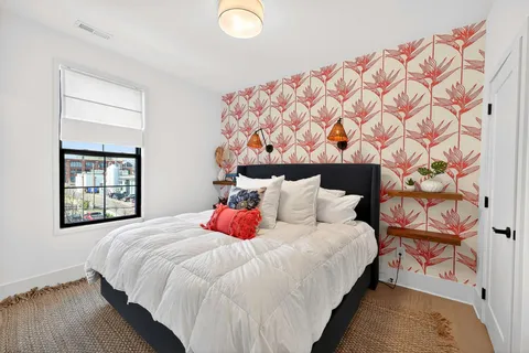 a bedroom with a bed and window