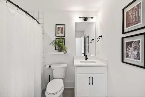 a bedroom with two beds and a window