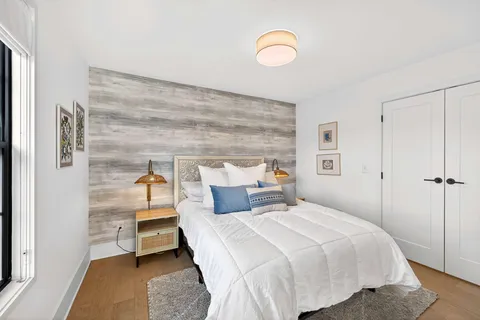 a terrace with outdoor seating and city view