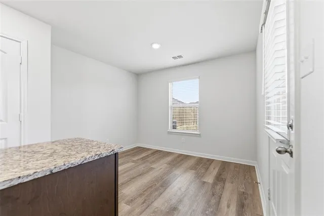 a view of an empty room and window