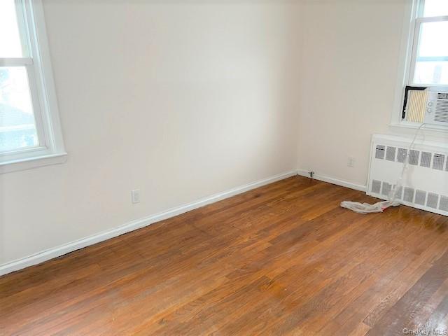 77 Kentucky Street, Unit UPPR Long Beach, NY 11561 - Photo 8 of 15 an empty room with a window