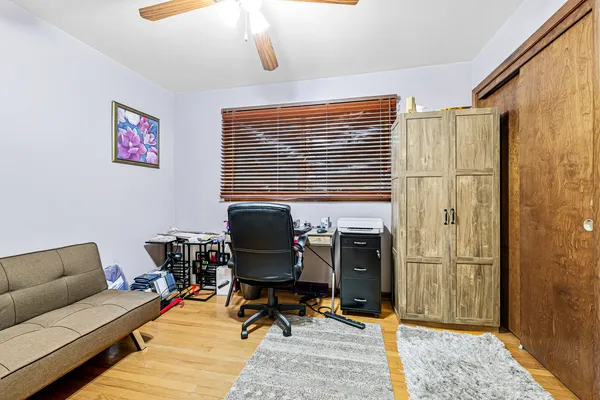 a work room with furniture and a window
