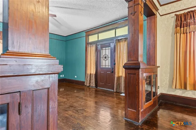 a kitchen with stainless steel appliances granite countertop a refrigerator and a stove