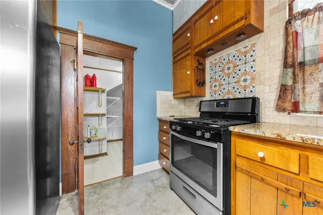 a bathroom with a sink a mirror and a shower