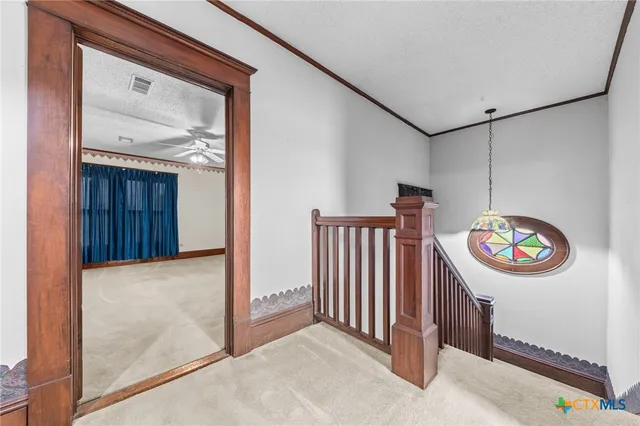 a view of a livingroom with a staircase