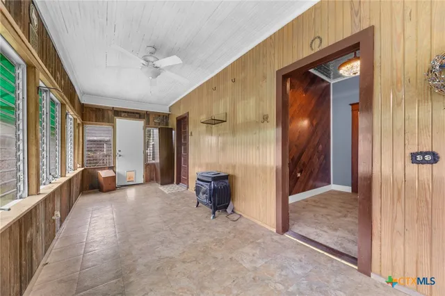 a front view of a house with a garden and deck