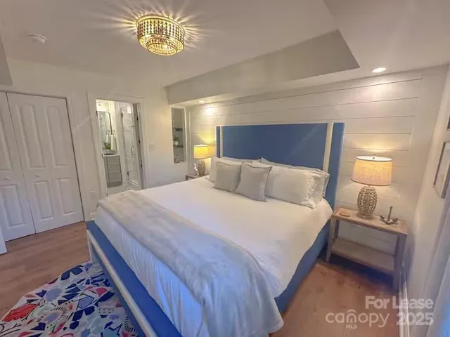 a bedroom with bed and window