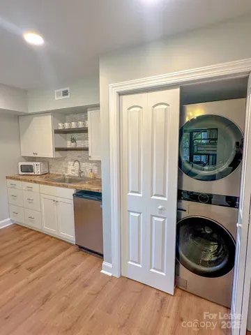 a kitchen with a washer and dryer
