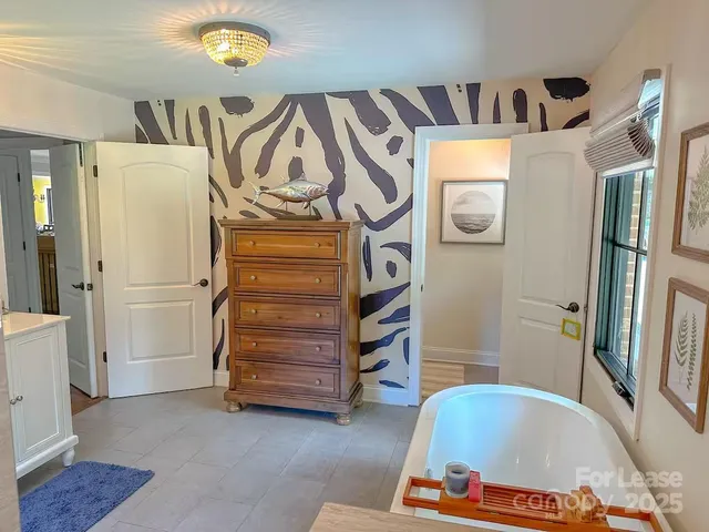 a bathroom with a bathtub and a shower