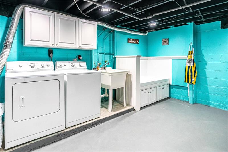 105 Deer Road Pittsburgh, PA 15237 - Photo 19 of 25 Enjoy doing laundry and washing the dog in this bright and cheery laundry and storage room. A new poured cement foundation was added for a completely level spot for the washer and dryer.