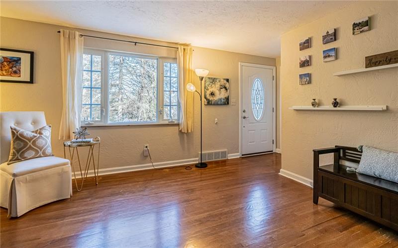 105 Deer Road Pittsburgh, PA 15237 - Photo 4 of 25 A picture window provides a peaceful view and filters plenty of light into the living room.