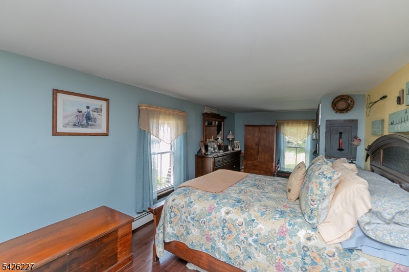 36 Main Street Flanders, NJ 07836 - Photo 22 of 49 a bed sitting in a spacious bedroom next to a window