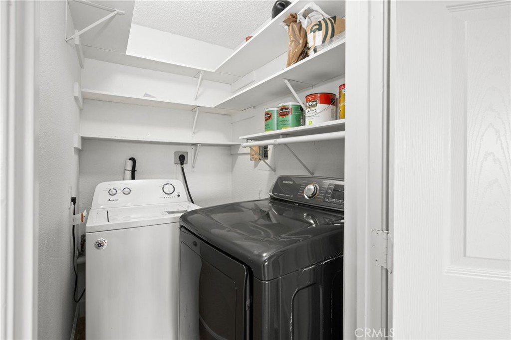 3142 Midway Drive, Unit B307 San Diego, CA 92110 - Photo 12 of 17 a utility room with dryer and washer