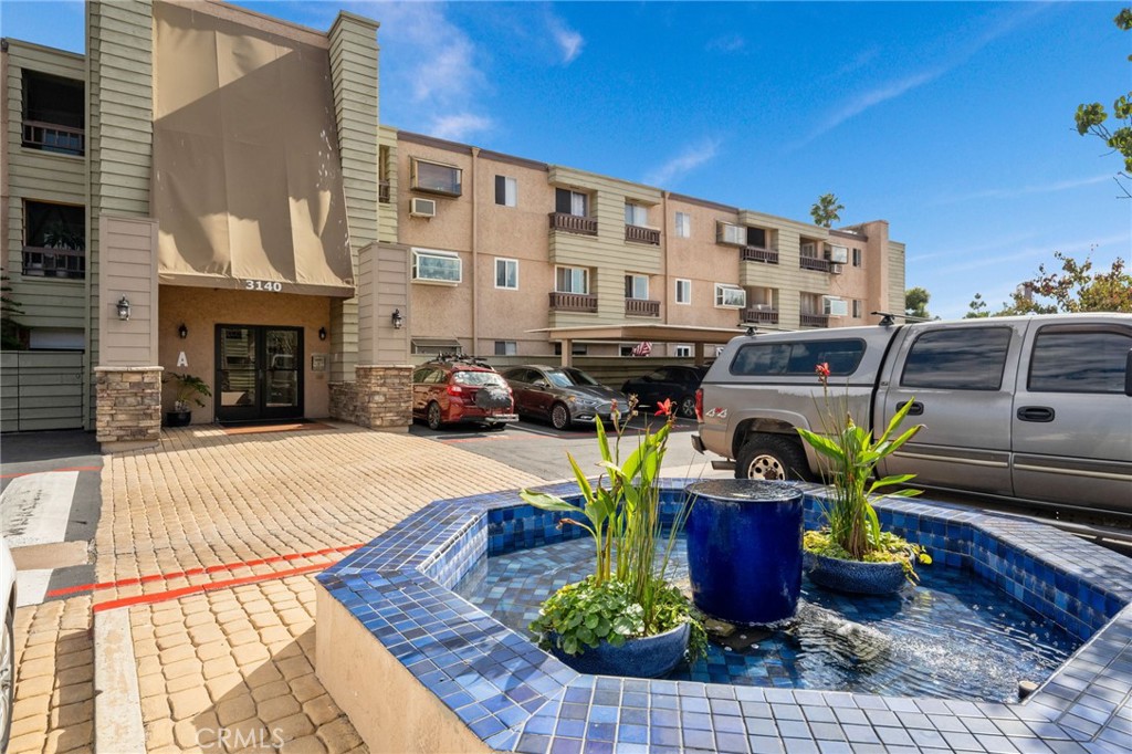 3142 Midway Drive, Unit B307 San Diego, CA 92110 - Photo 3 of 17 a view of a building with sitting area