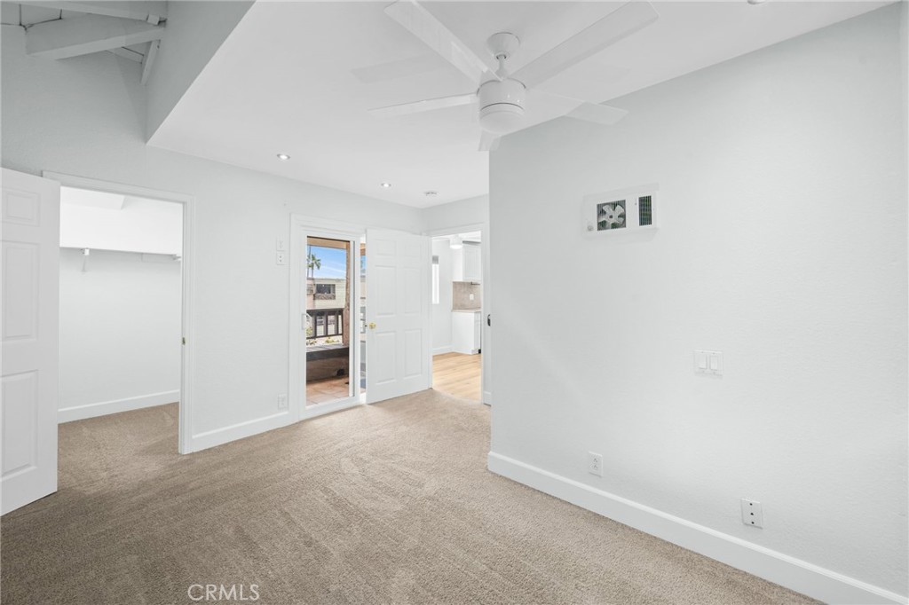 3142 Midway Drive, Unit B307 San Diego, CA 92110 - Photo 6 of 17 an empty room with a bench and cabinet