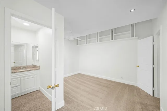 a view of a kitchen cabinets and wooden floor
